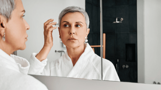 mature woman in front of mirror