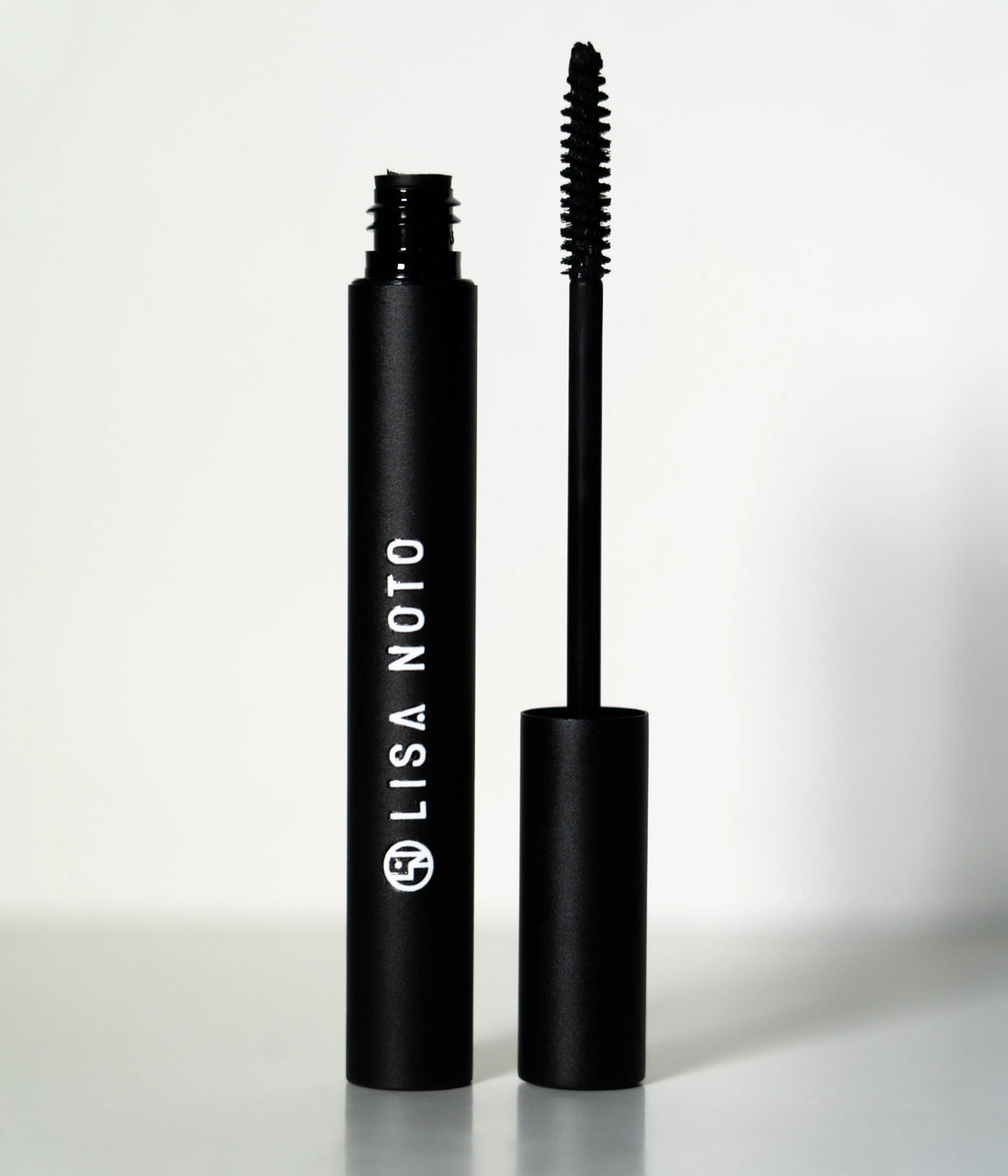 LISA NOTO natural volumizing mascara with gentle formula and botanical ingredients for long, thick lashes, perfect for sensitive eyes.