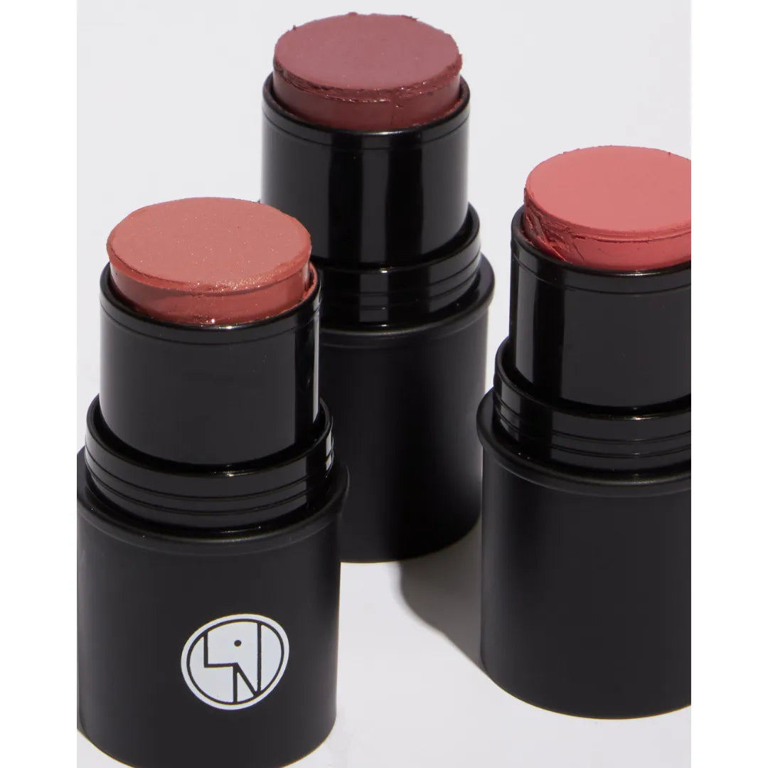 Three Lisa Noto Natural Radiance Sticks in rose and mauve shades — vegan multi-use stick for lips, cheeks and eyes