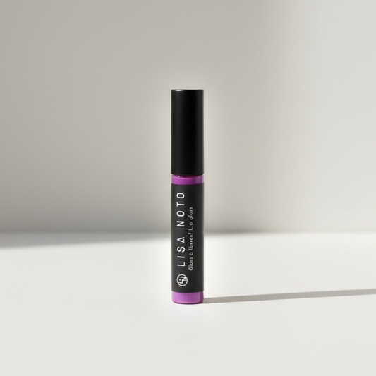 Metallic lilac hydrating lip gloss by Lisa Noto on a light neutral grey background, clean high-end e-commerce image with soft luminous light.